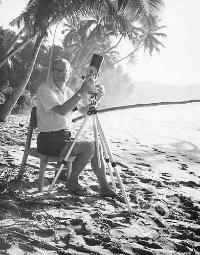 Arthur C. Clarke on a beach in Sri Lanka with his Questar telescope