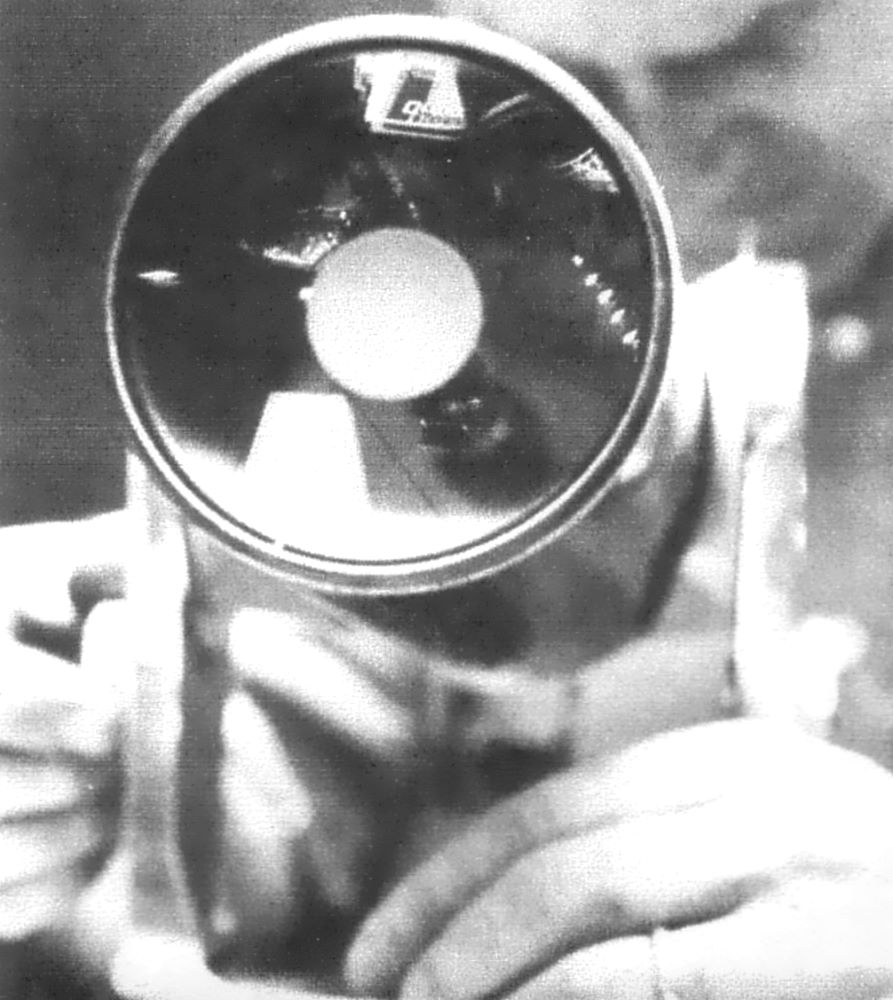 A worker fine tuning a Questar
