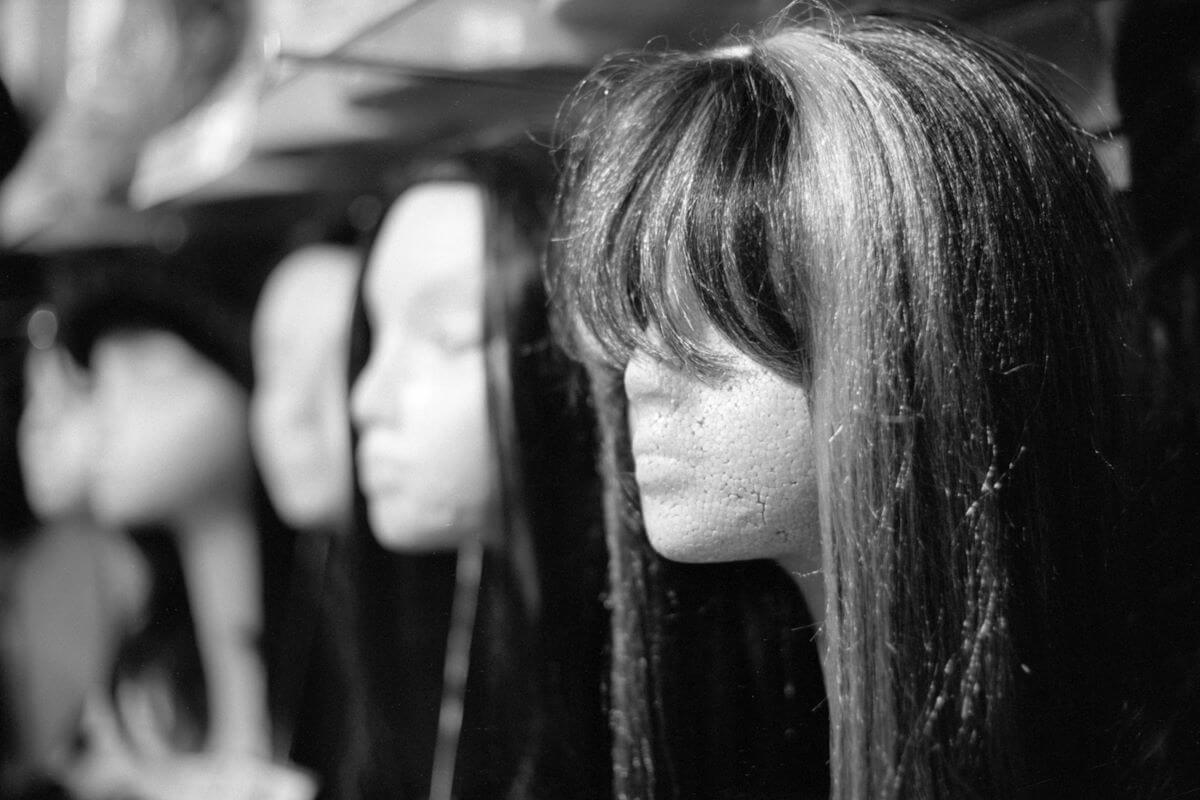 Row of wigs at a costume shop